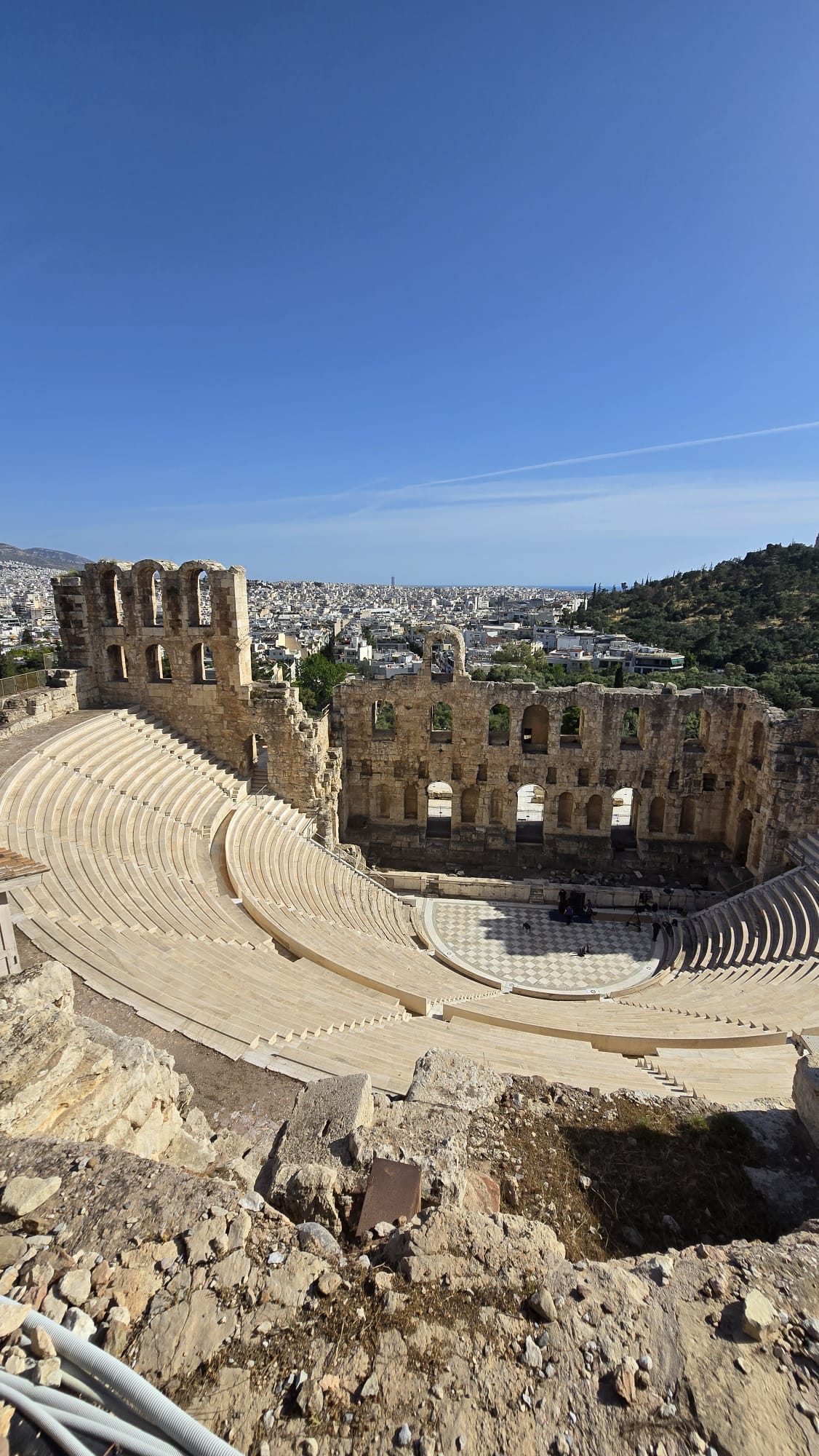 The Odeon of Herodes Atticus — the stone Roman theatre on the slope of the Acropolis, its arched stage wall intact