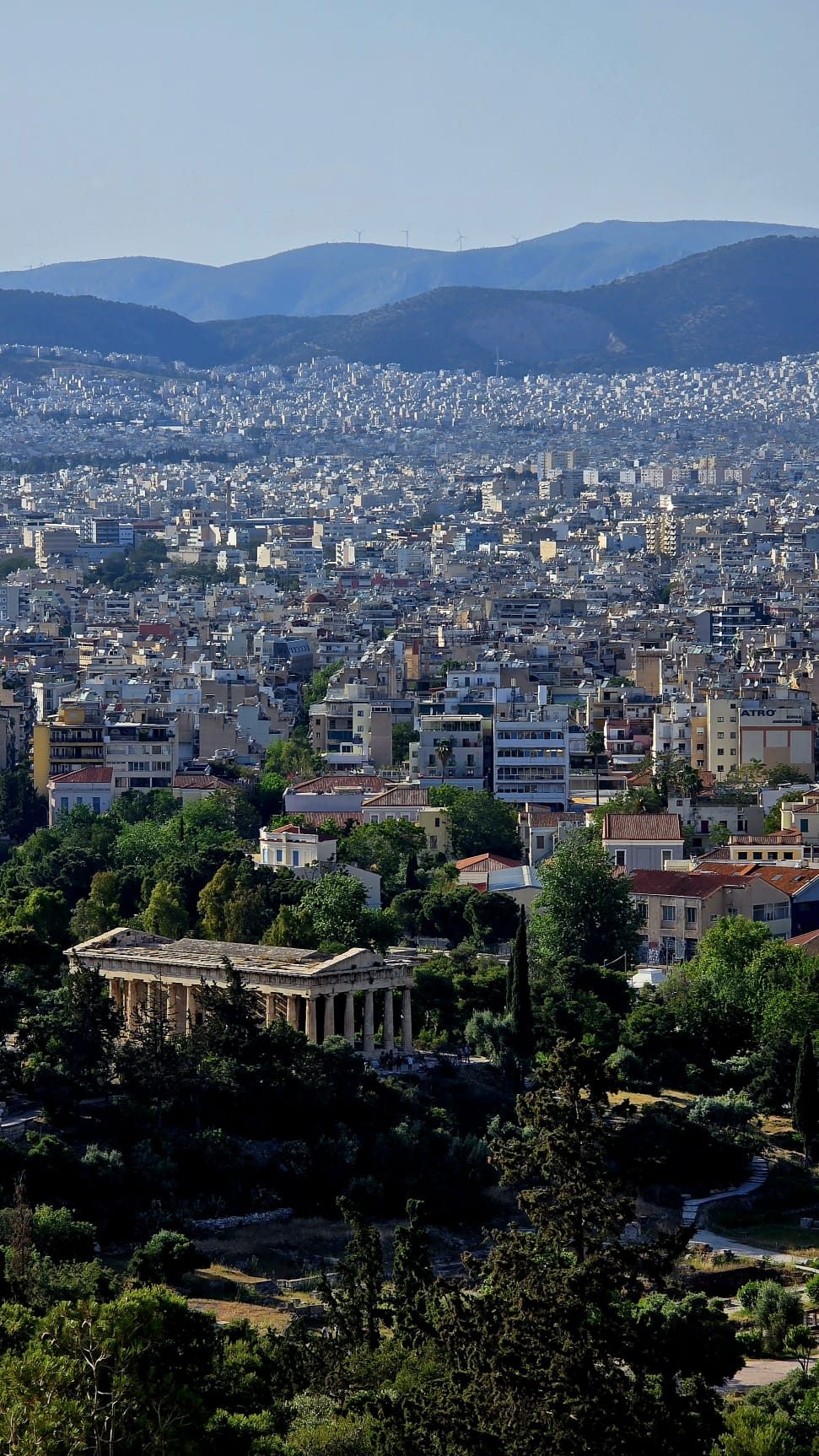 A street in central Athens looking toward the Acropolis, neoclassical buildings lining the route