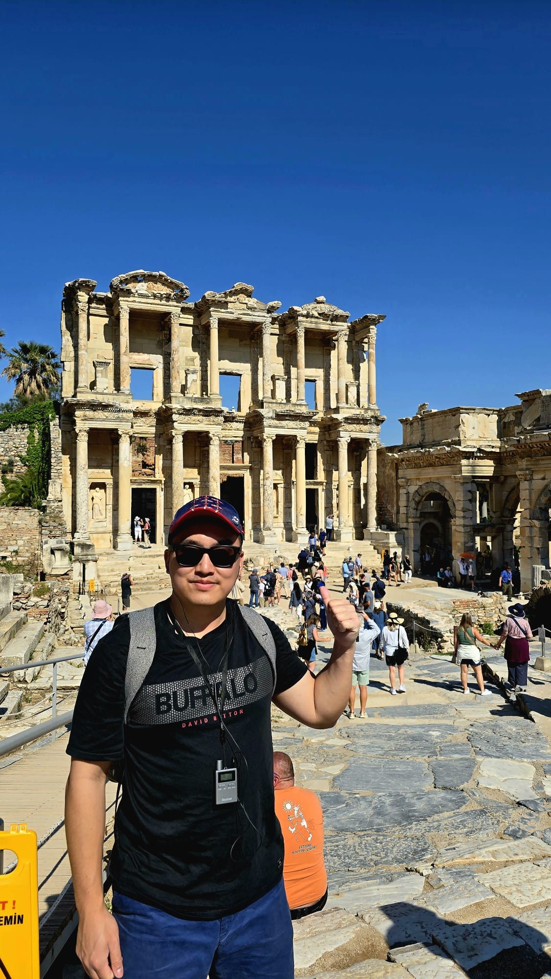 Sam standing in front of the Library of Celsus façade at Ephesus, giving a sense of the monument's scale