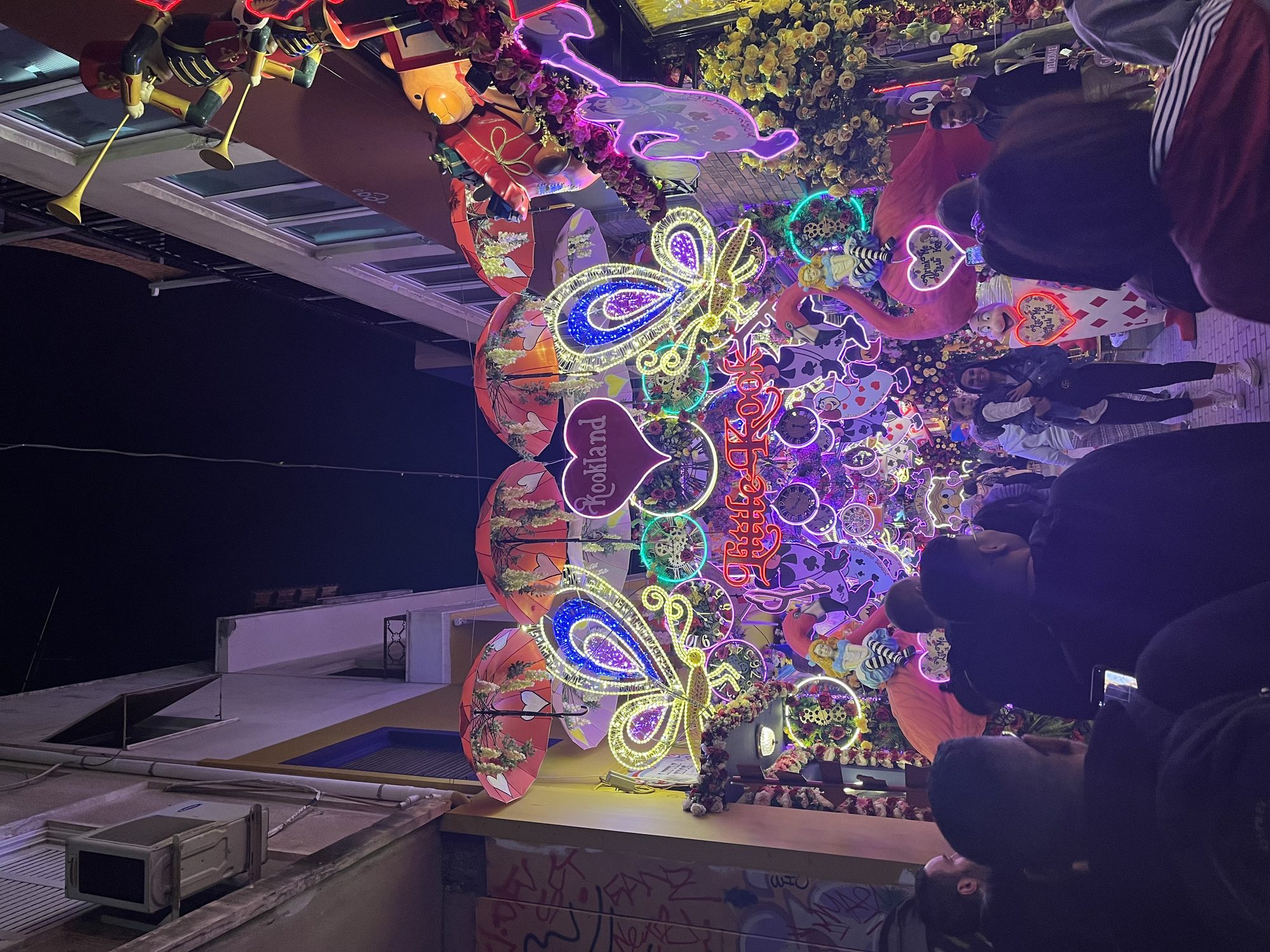 The terrace of Little Kook in Athens at night — the famously over-decorated themed café in the Psiri neighbourhood, lit in warm colours