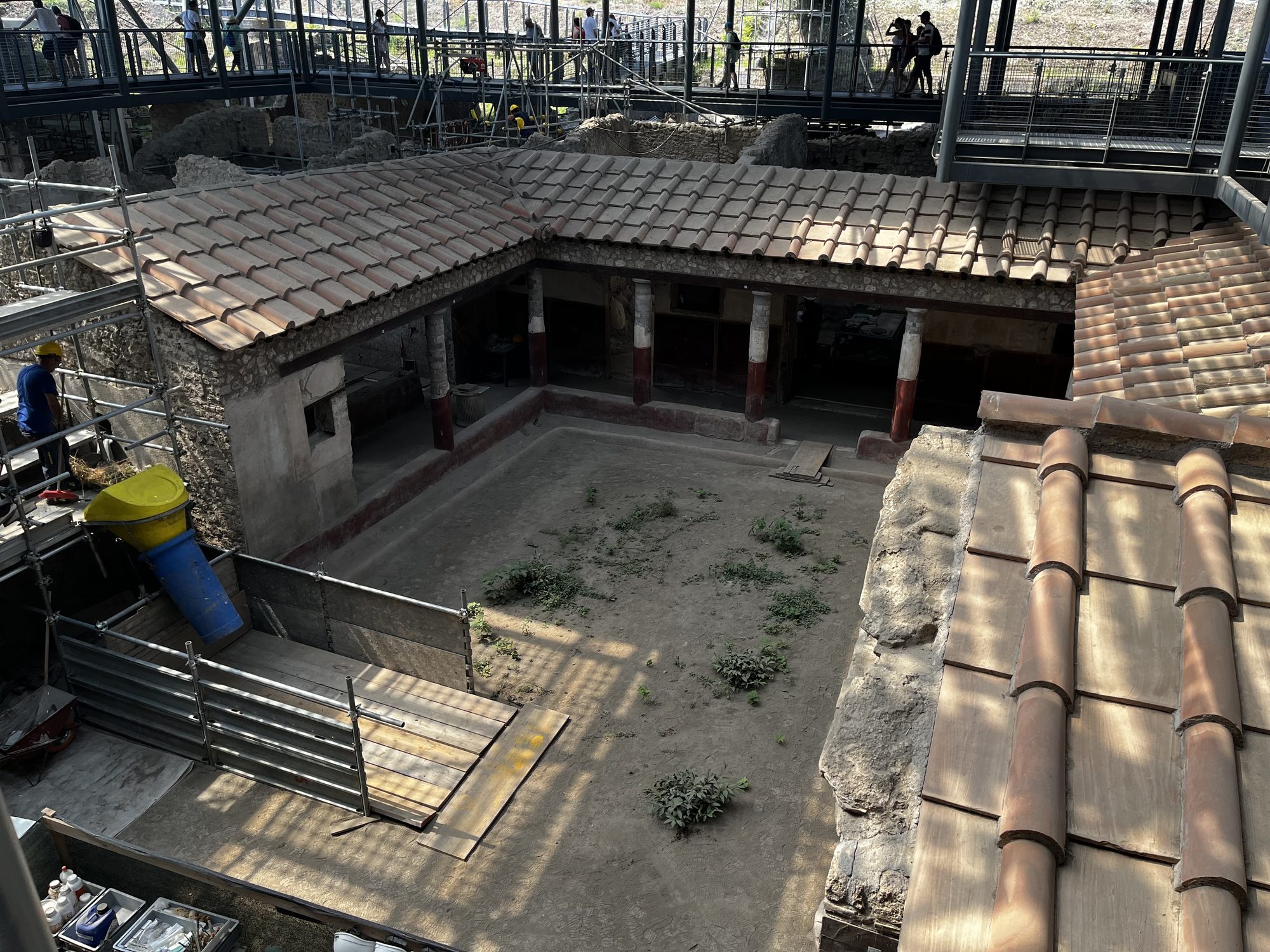 An active Pompeii excavation site viewed from above — archaeologists and workers still uncovering the ancient city in 2024