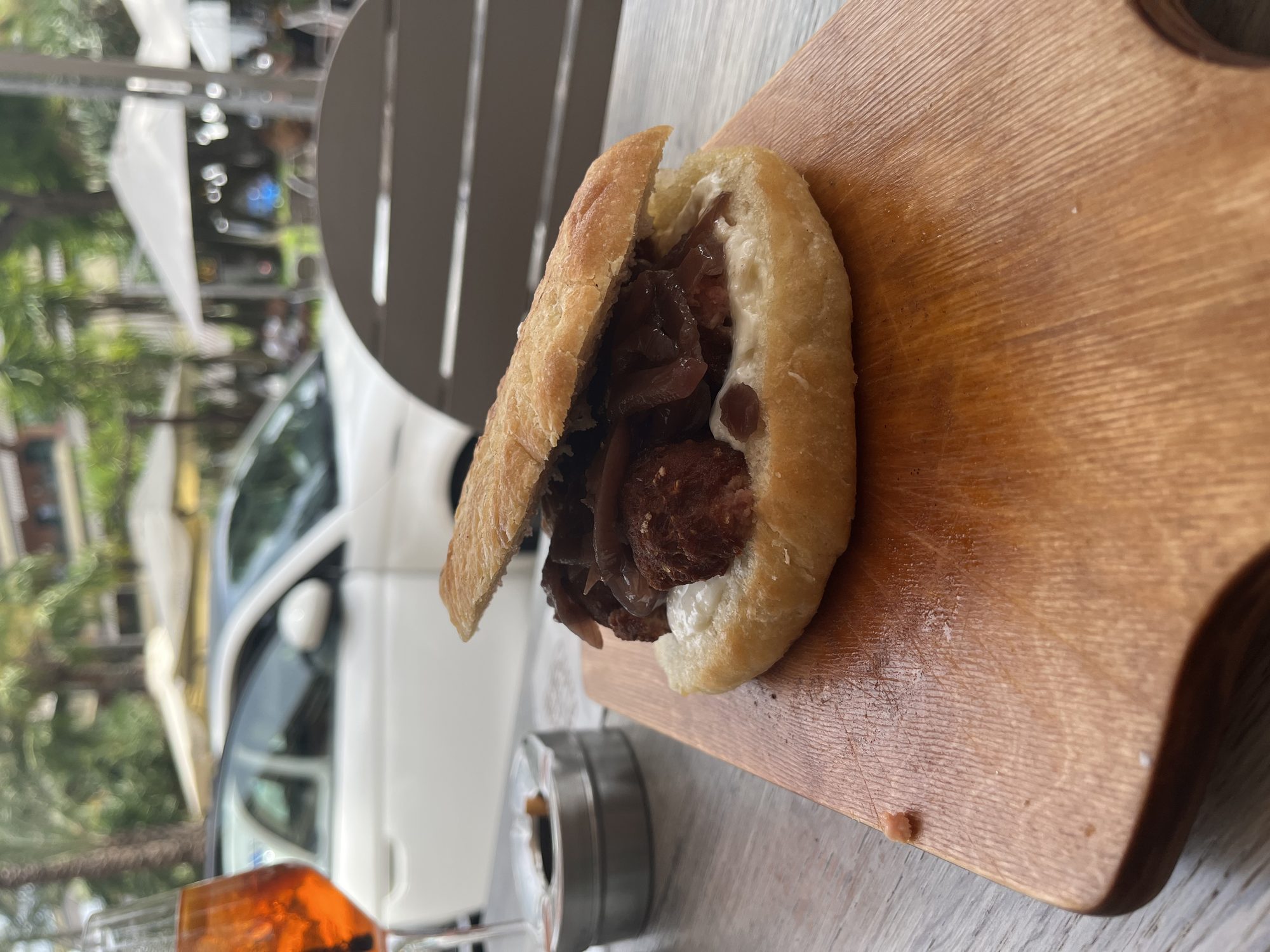 The sausage and mozzarella sandwich at Spizzichiamo Sorrento, served on a wooden board with an Aperol Spritz